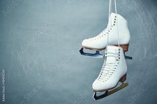 Women's skates with laces on a gray background.