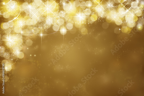 Gold festive background. Abstract golden light, radiance with bokeh