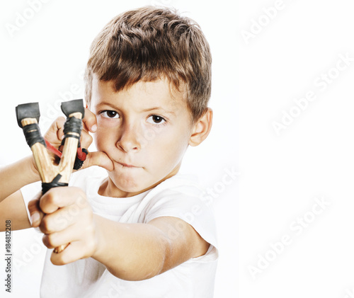 little cute angry real boy with slingshot isolated