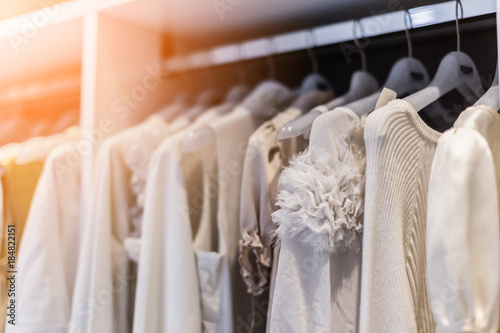 WHITE SOFT CLOTHS HANG IN WARDROBE INTERIOR CONCEPT