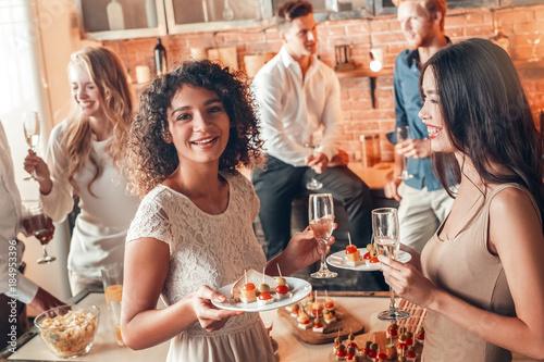 Group of friends party together indoors celebration