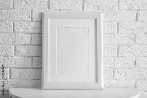 Mockup of blank frame on table