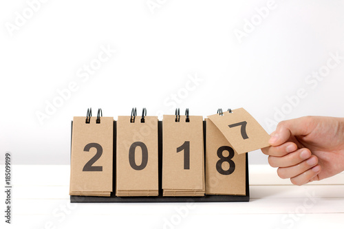 New Year 2018 is coming concept. Hand change 2017 to 2018 .