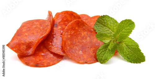 Slices of pepperoni on white background