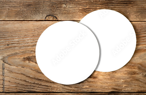 Beer coaster mock up on wooden background