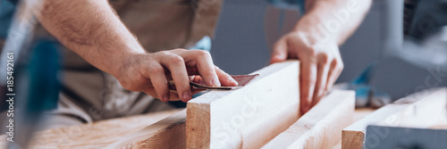 Sandpaper being used by woodworker