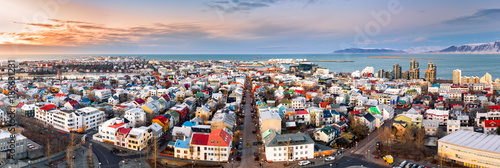 Aerial panorama of downtown Reykjavik at sunset with colorful houses and commercial streets