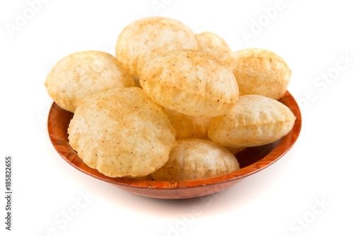 Puffed fried puri isolated on a white background isolated on a white background