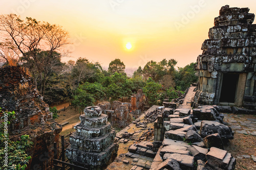 Sunset of Phnom Bakheng, one of the ruined temples of ancient Cambodia.