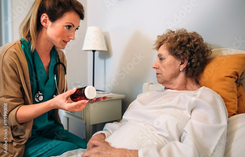 Female doctor explaining posology to a senior patient