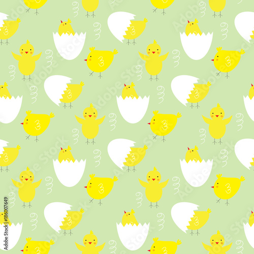 Green wallpaper with yellow chickens in different poses and eggs. 