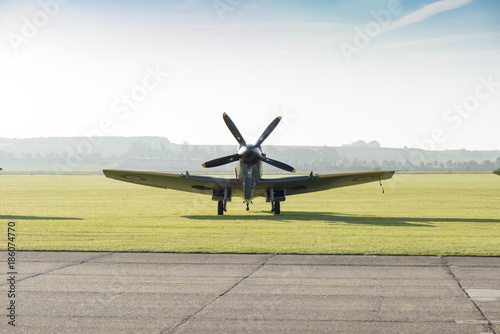 Front View of Classic Spitfire Aircraft by a Runway
