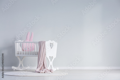 White baby's bedroom with cradle