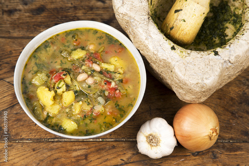 Bowl of pistou soup on an old wooden table