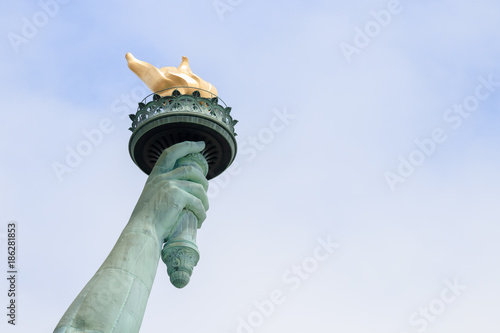 Close up of torch of the Statue of Liberty in New York City. This is the copper statue which is a gift from the people of France to the people of the United States. It’s a famous attraction in US.