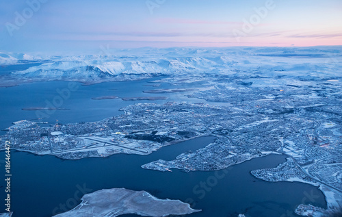 View of Keflavik city in winter through airplane window.