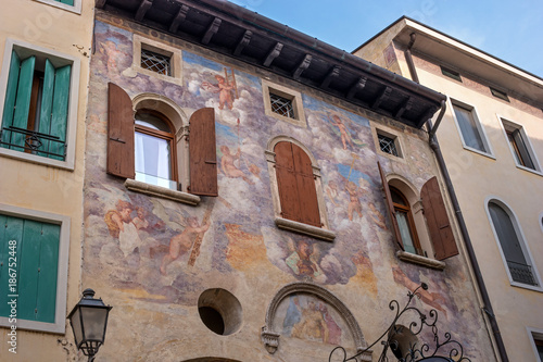 An ancient fresco on the wall of the house. Conegliano. Italy.