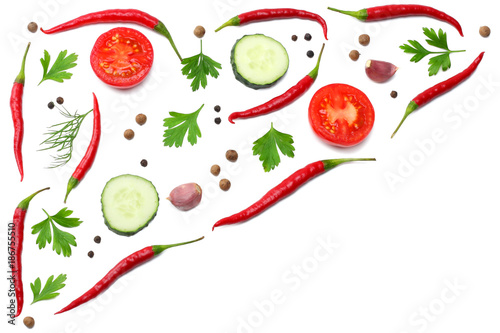 mix red hot chili peppers with parsley and sliced cucumber and garlic isolated on white background top view