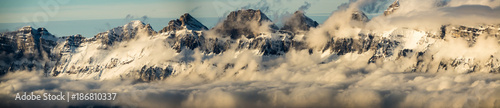 panorama view of the Churfirsten mountains in the Swiss Alps in winter with cloud banks