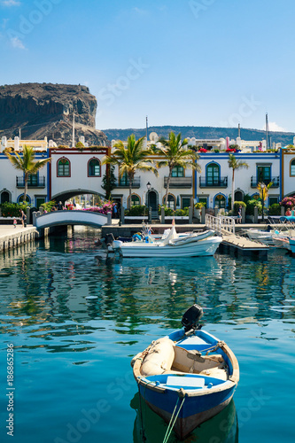 Colourful port with palm trees Puerto De Mogan on Gran Canaria island.