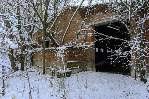 Old destroyed by time and vandals industrial building of the times of the USSR. December 2017