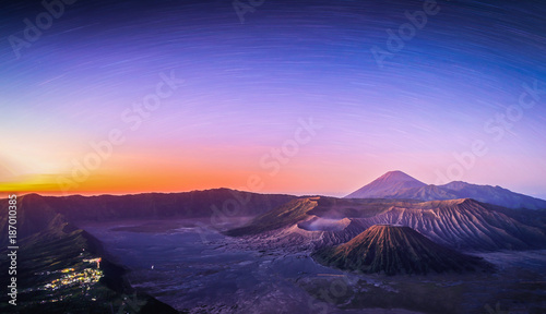 Mount Bromo volcano (Gunung Bromo) at sunrise with star trail in Bromo Tengger Semeru National Park, East Java, Indonesia.