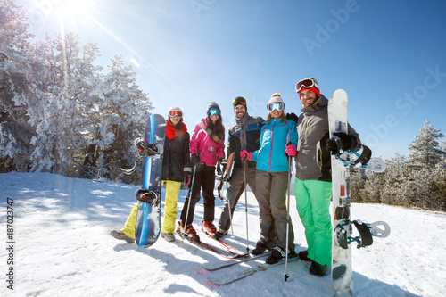 Group of skiers and boarders together on mountain