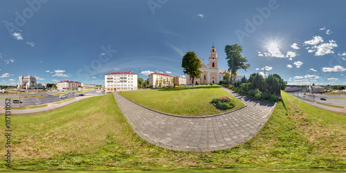Full 360 by 180 degrees seamless equirectangular spherical panorama of the city in sunny day with beautiful clouds near the church in view on highway. VR AR content