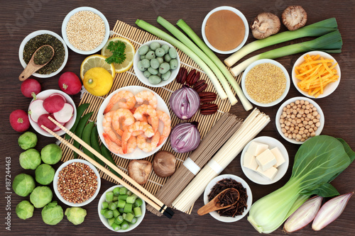 Japanese macrobiotic super food concept with tofu, soba and udon noodles, miso, wasabi nuts, kuchika tea, grains, legumes, vegetables, with foods high in protein, antioxidants and vitamins.