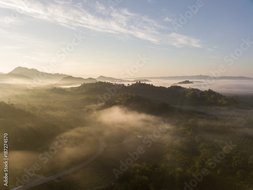 Mountains and trees with beautiful clouds and sky in sunrise,Landscape nature with aerial camera shot,Kanchanaburi Thailand.