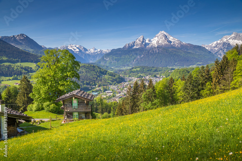 Idyllic mountain scenery with old mountain chalet in the Alps in summer