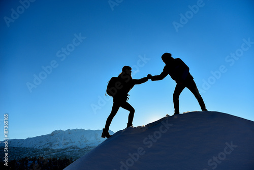 female mountaineer help hand