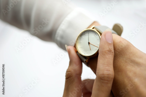 woman looking at her watch.