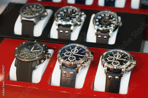 Collection of modern watches in the shop window.