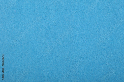 Blue felt background texture close up