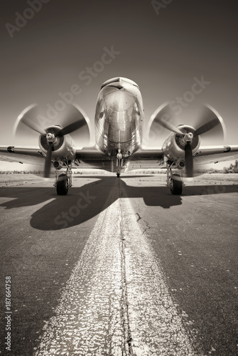 historic aircraft is waiting for take off on a runway