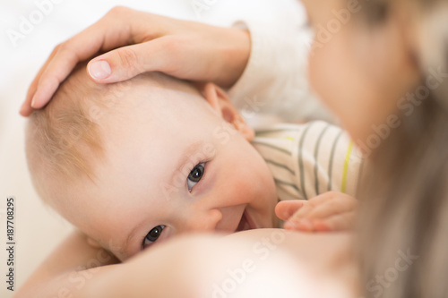 Picture of baby feeds mom's breast