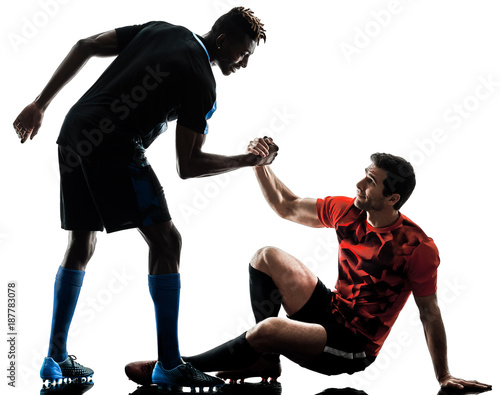 two soccer players men in studio silhouette isolated on white background