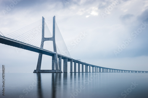 Vasco da Gama Bridge at sunrise in Lisbon, Portugal. he longest bridge in Europe