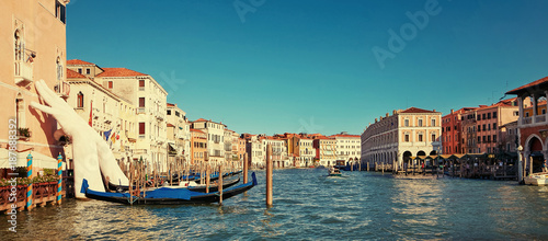 Venice, Italy - August 14, 2017: Giant hands up from the water of the Grand Canal to support the building. This powerful report on the climate change from the artist Lorenzo Quinn.