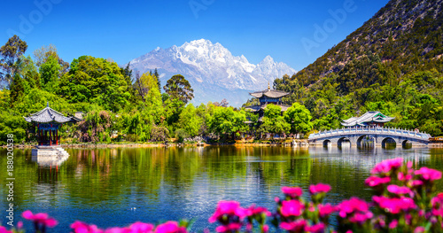 Black Dragon Pool and Jade Dragon Snow Mountain. It's a famous pond in the scenic Jade Spring Park (Yu Quan Park) located at the foot of Elephant Hill, old Town of Lijiang in Yunnan, China.