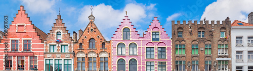 Traditional colorful Belgian facades of houses at Market square in city of Bruges.