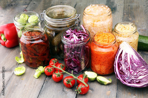 Jars with variety of pickled vegetables. Preserved food