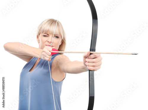 Attractive woman practicing archery on white background
