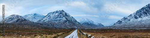 landscape view of scotland and the entrance to glen etive near buchaille etive mor in winter in panoramic landscape format