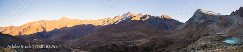 The Alps in Italy at sunset, famous travel destination in summertime. Ultra wide panoramic view