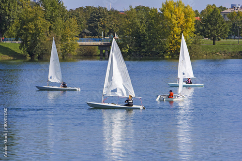 Regatta sailing of small boats on the lake