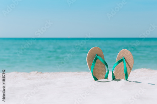 Ocean landscape And sandals on the beach. Welcome summer