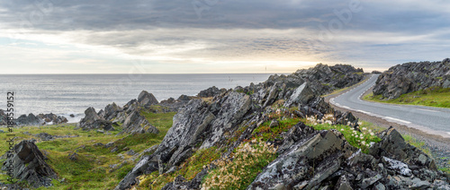 Rocky cliffs on the coast of the Barents Sea along the Varanger Tourist Route