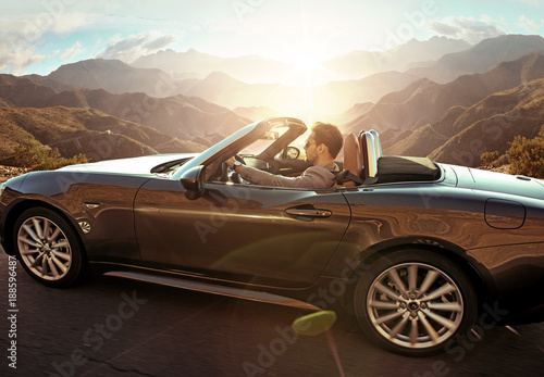 Elegant man driving a convertible